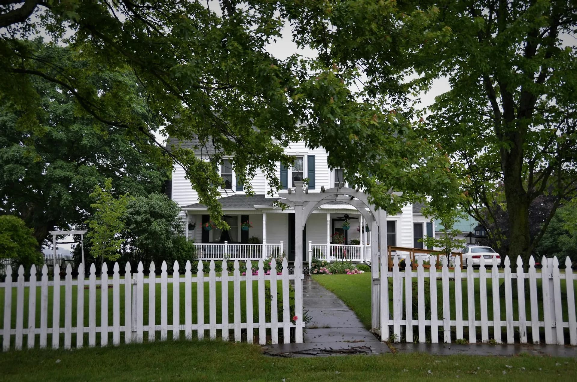 Clean white residential fence in front of a Fox Valley home