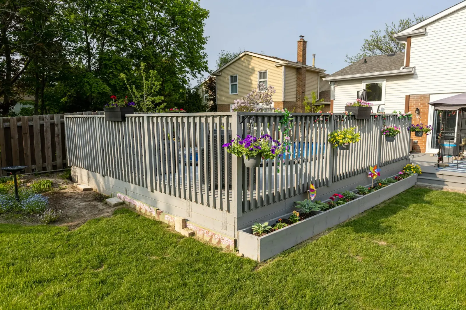 Freshly built backyard privacy fence at an Aurora, IL home under a clear sky