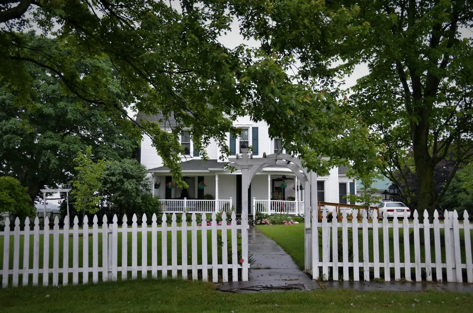 Clean white residential fence in front of a Fox Valley home
